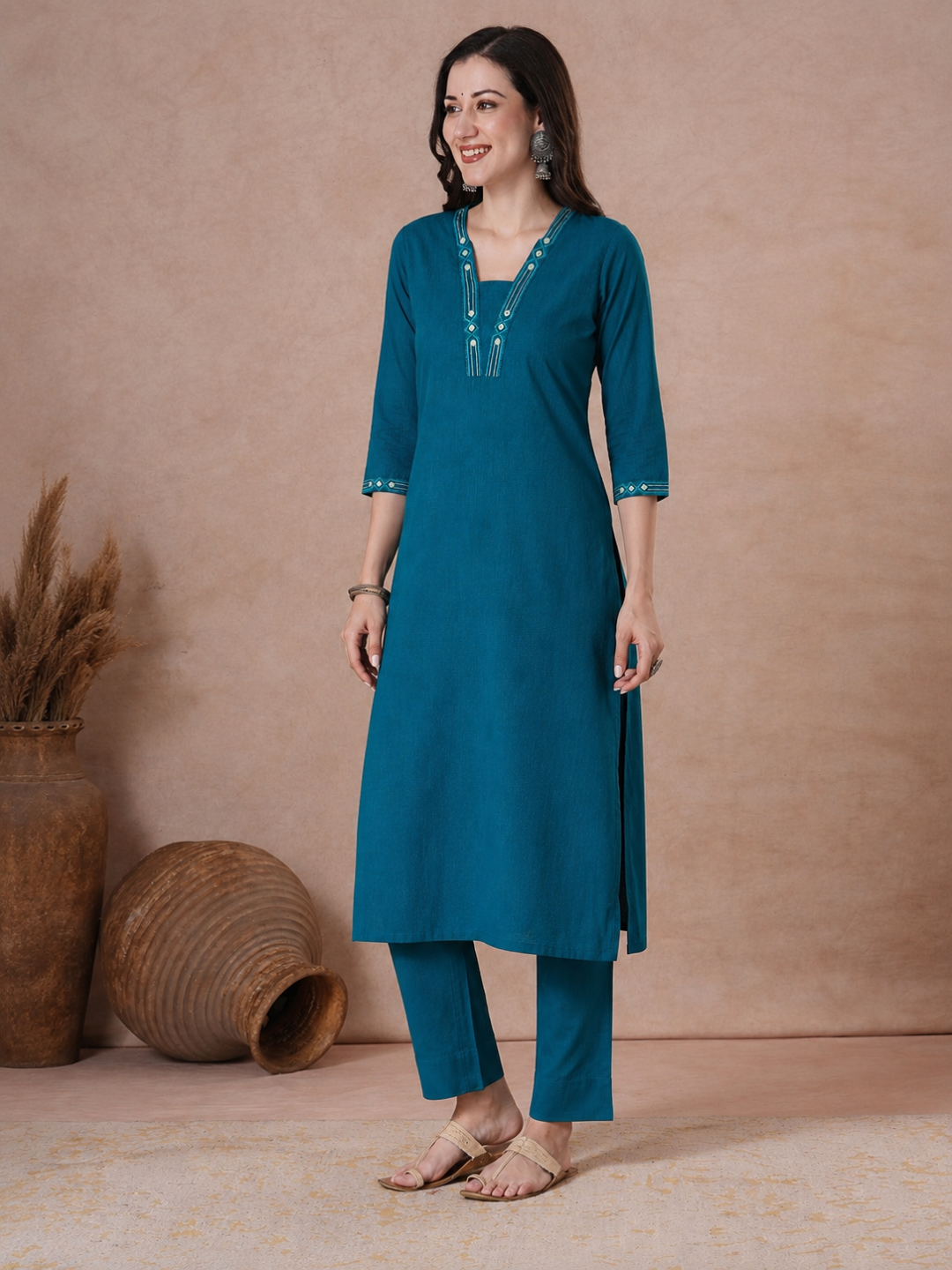 Straight Fit Cotton Kurta with Geometric Machine Embroidery on V-Neck and Sleeves.