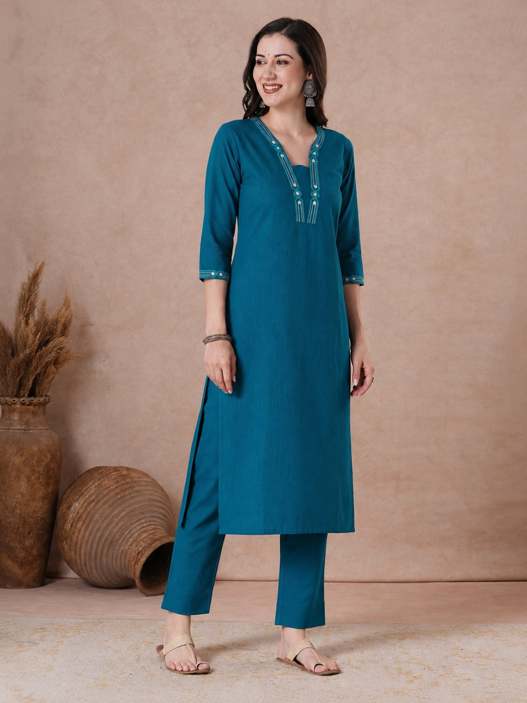 Straight Fit Cotton Kurta with Geometric Machine Embroidery on V-Neck and Sleeves.