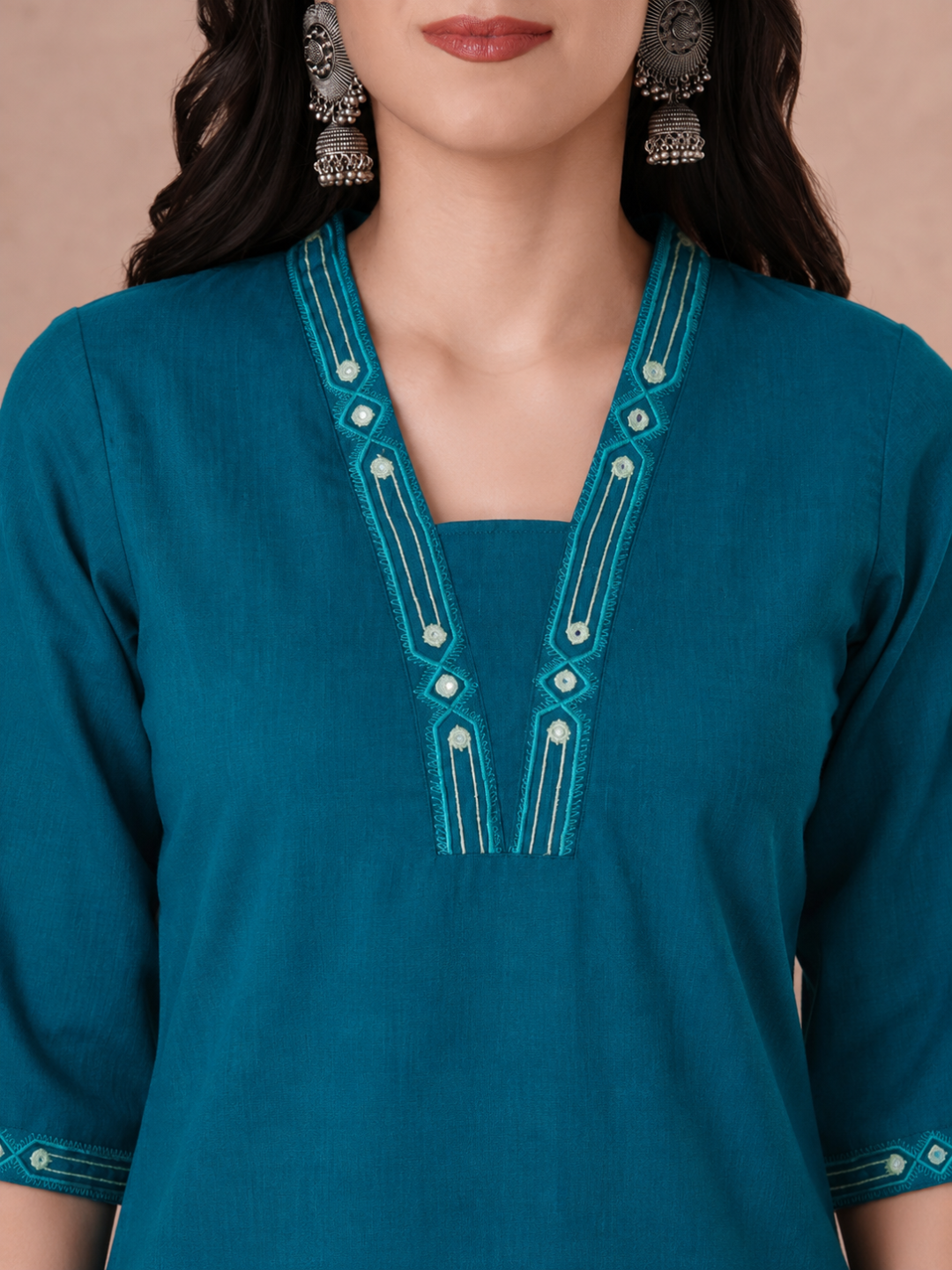Straight Fit Cotton Kurta with Geometric Machine Embroidery on V-Neck and Sleeves.