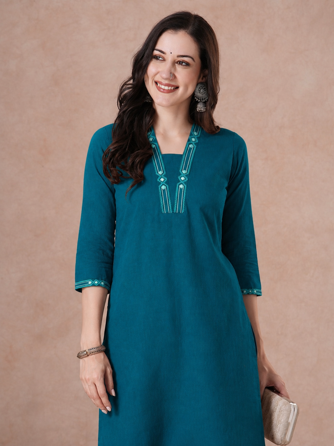 Straight Fit Cotton Kurta with Geometric Machine Embroidery on V-Neck and Sleeves.