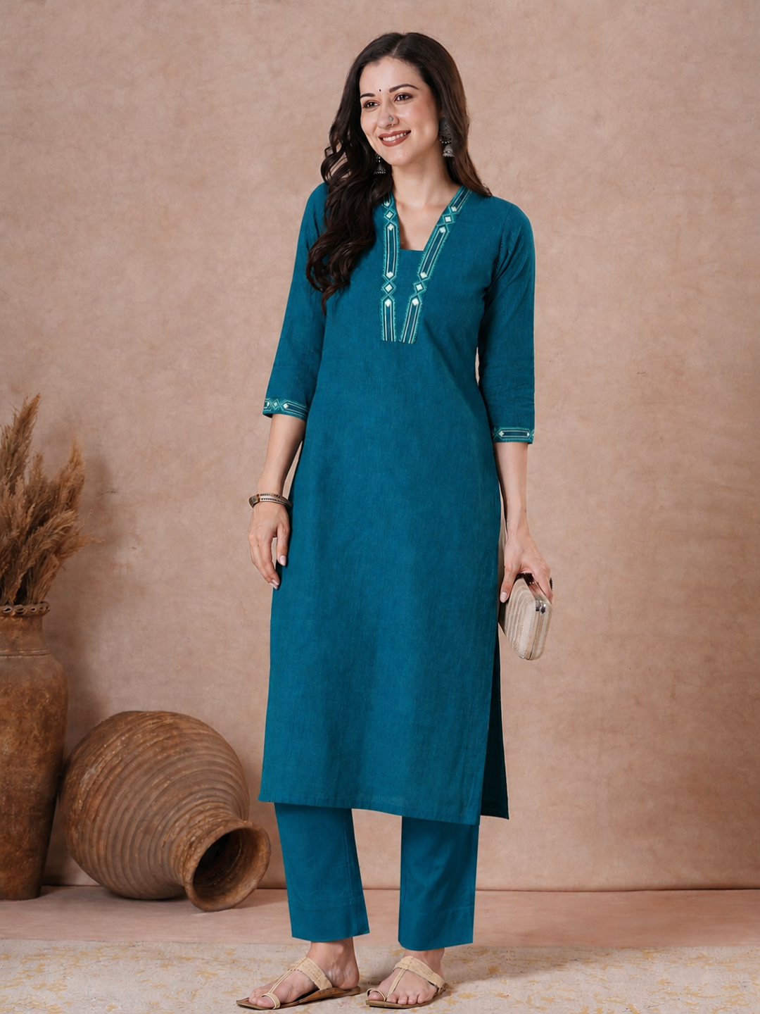 Straight Fit Cotton Kurta with Geometric Machine Embroidery on V-Neck and Sleeves.