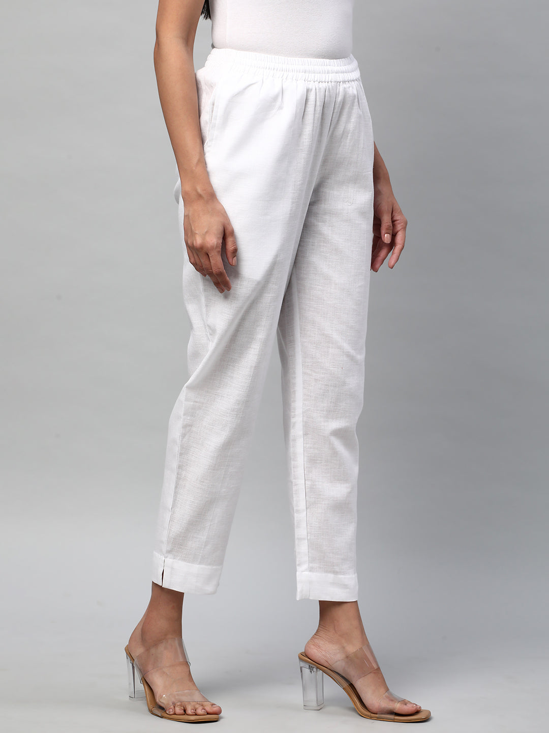 A fully elasticated white ankle length cotton linen pant