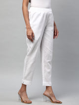 A fully elasticated white ankle length cotton linen pant