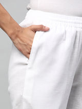 A fully elasticated white ankle length cotton linen pant