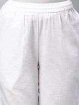 A fully elasticated white ankle length cotton linen pant