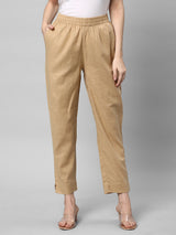 A fully elasticated beige ankle length cotton linen pant