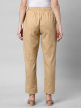 A fully elasticated beige ankle length cotton linen pant