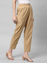 A fully elasticated beige ankle length cotton linen pant