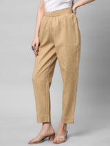 A fully elasticated beige ankle length cotton linen pant