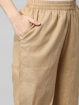A fully elasticated beige ankle length cotton linen pant