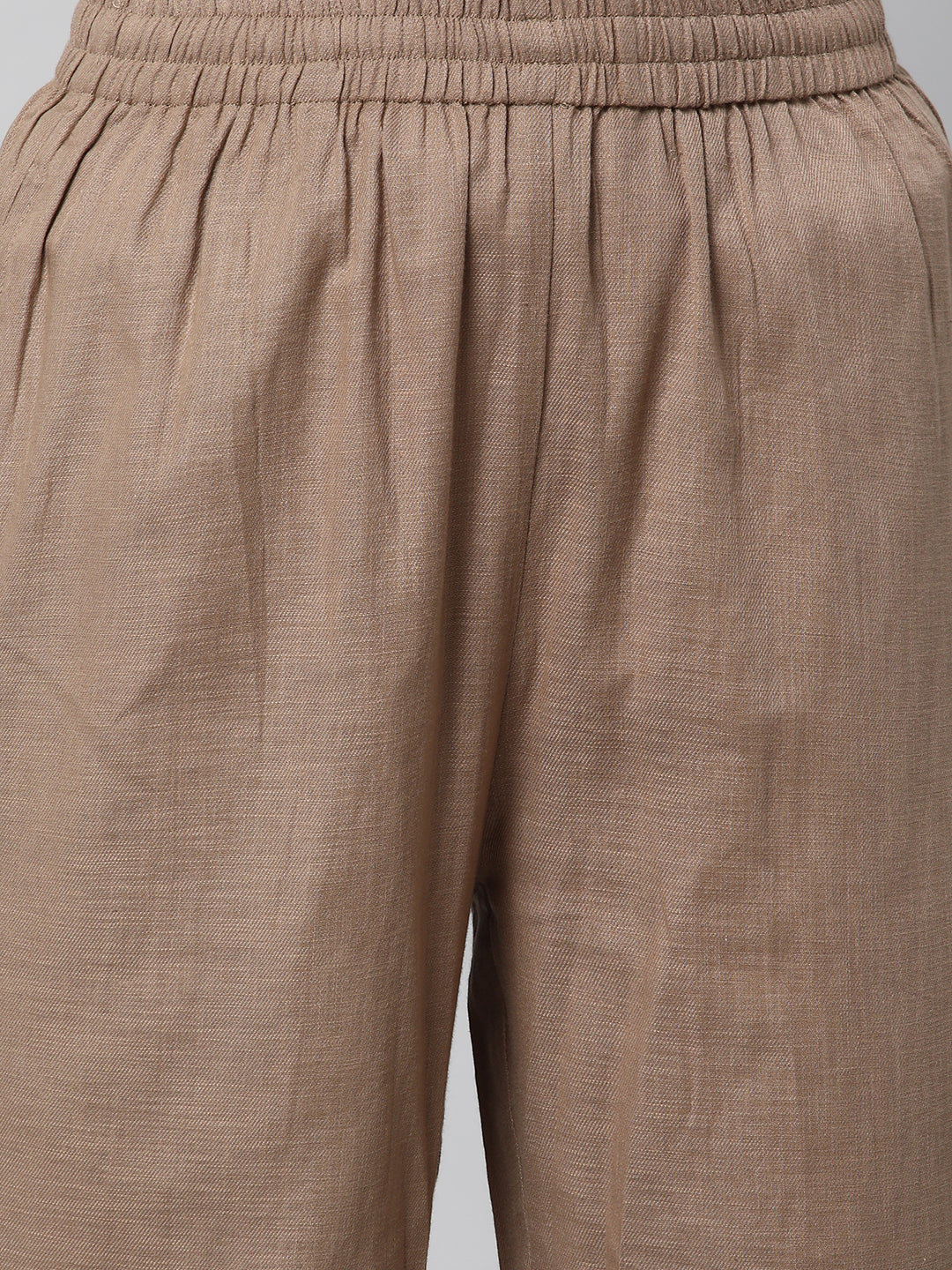 A fully elasticated brown ankle length cotton linen pant