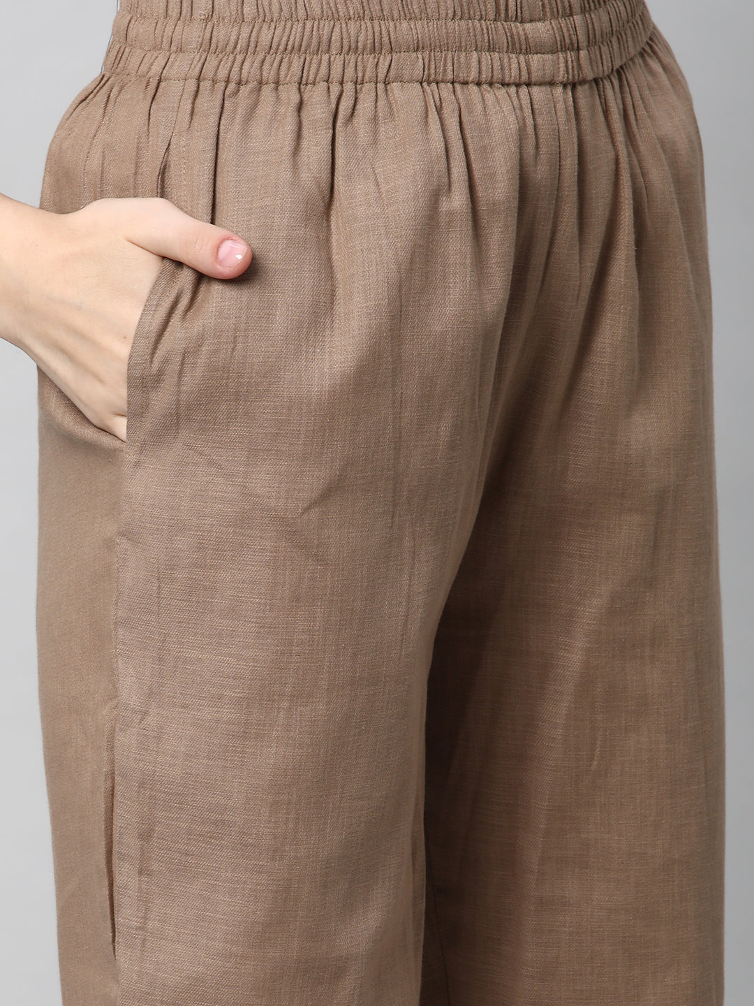 A fully elasticated brown ankle length cotton linen pant