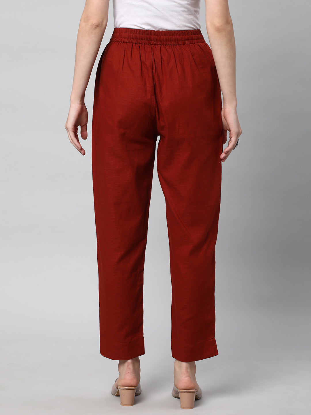 A fully elasticated rust ankle length cotton linen pant