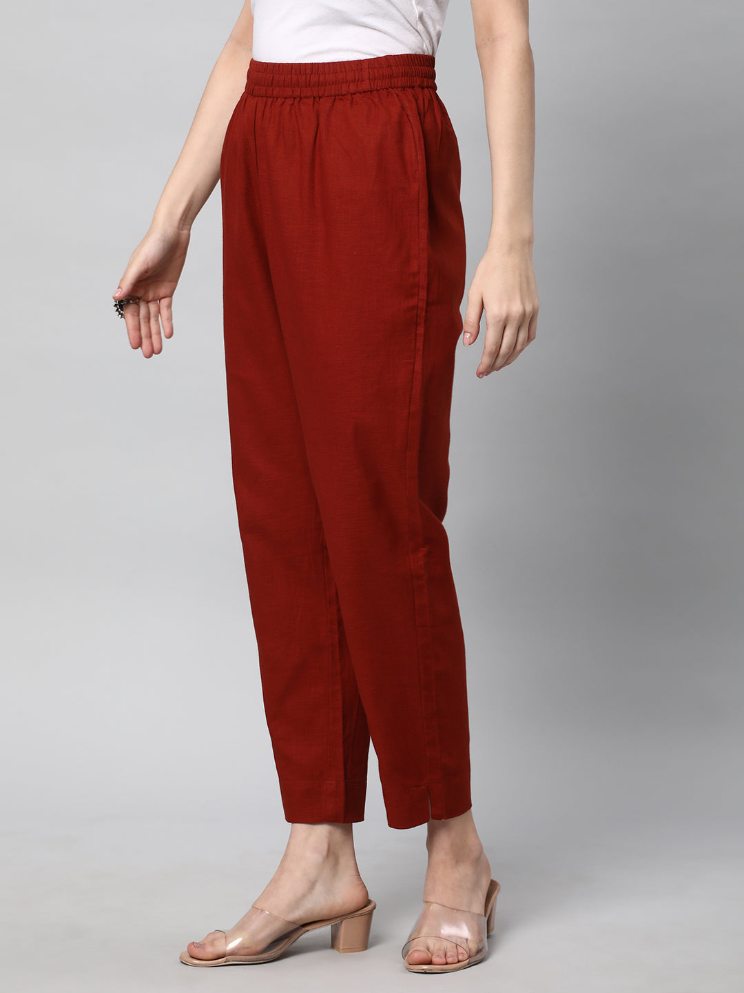 A fully elasticated rust ankle length cotton linen pant