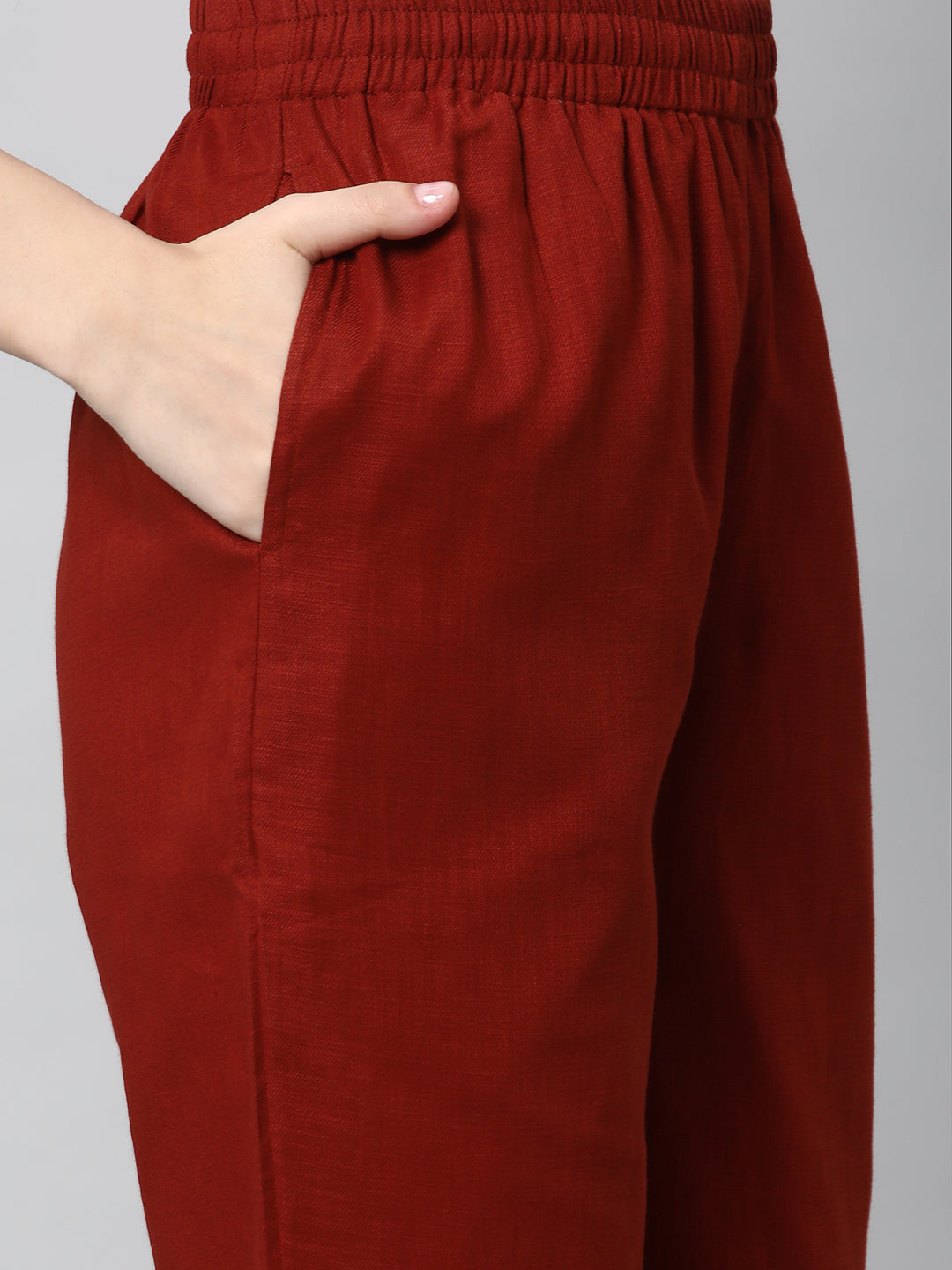 A fully elasticated rust ankle length cotton linen pant