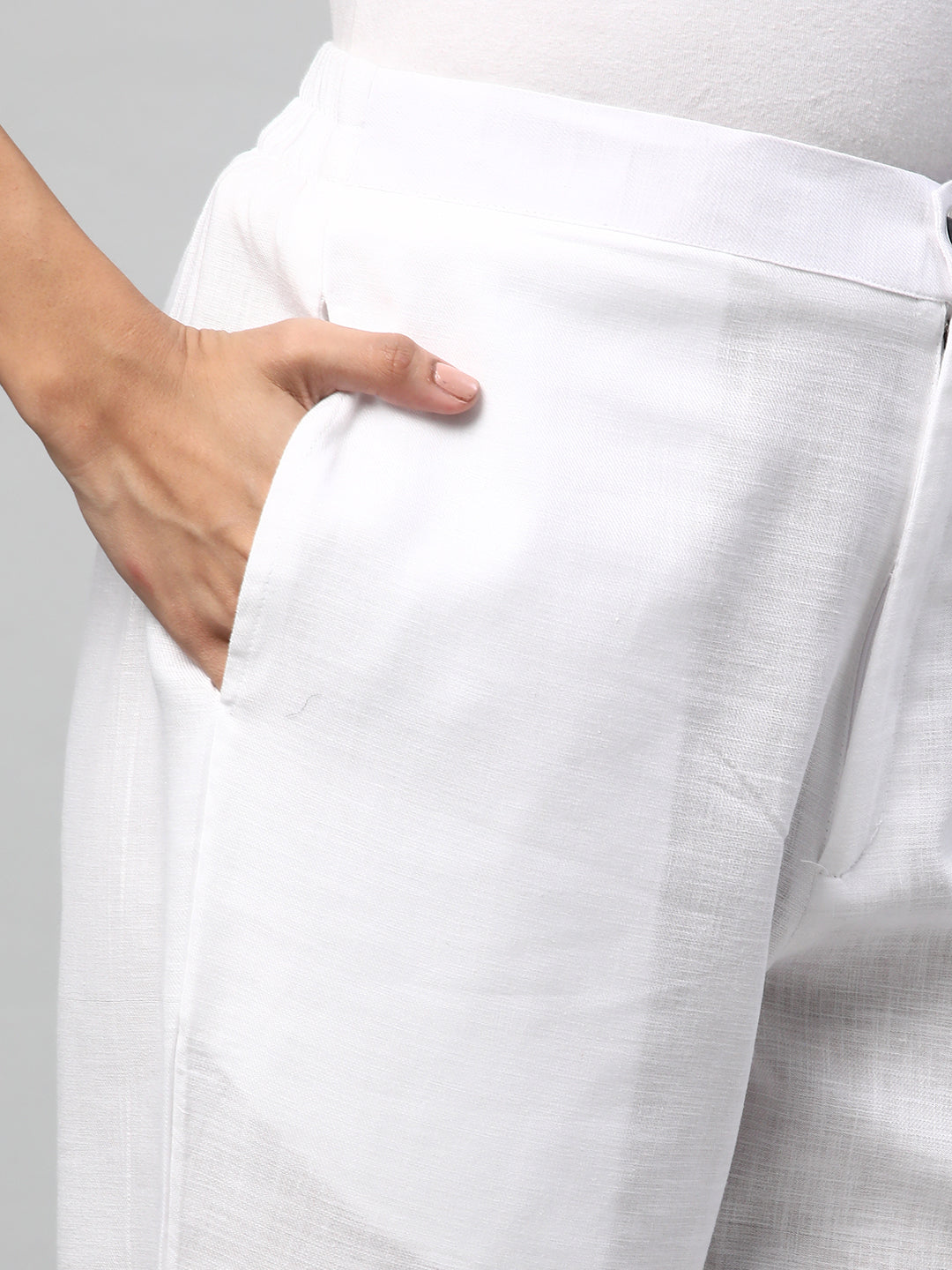 A White ankle length coton linen pant with plain belt in front