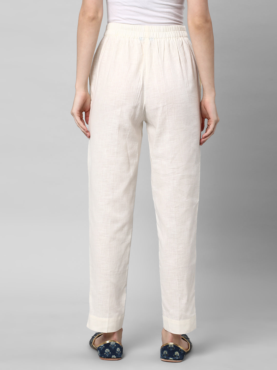 A Off-white ankle length cotton linen pant with plain belt in front