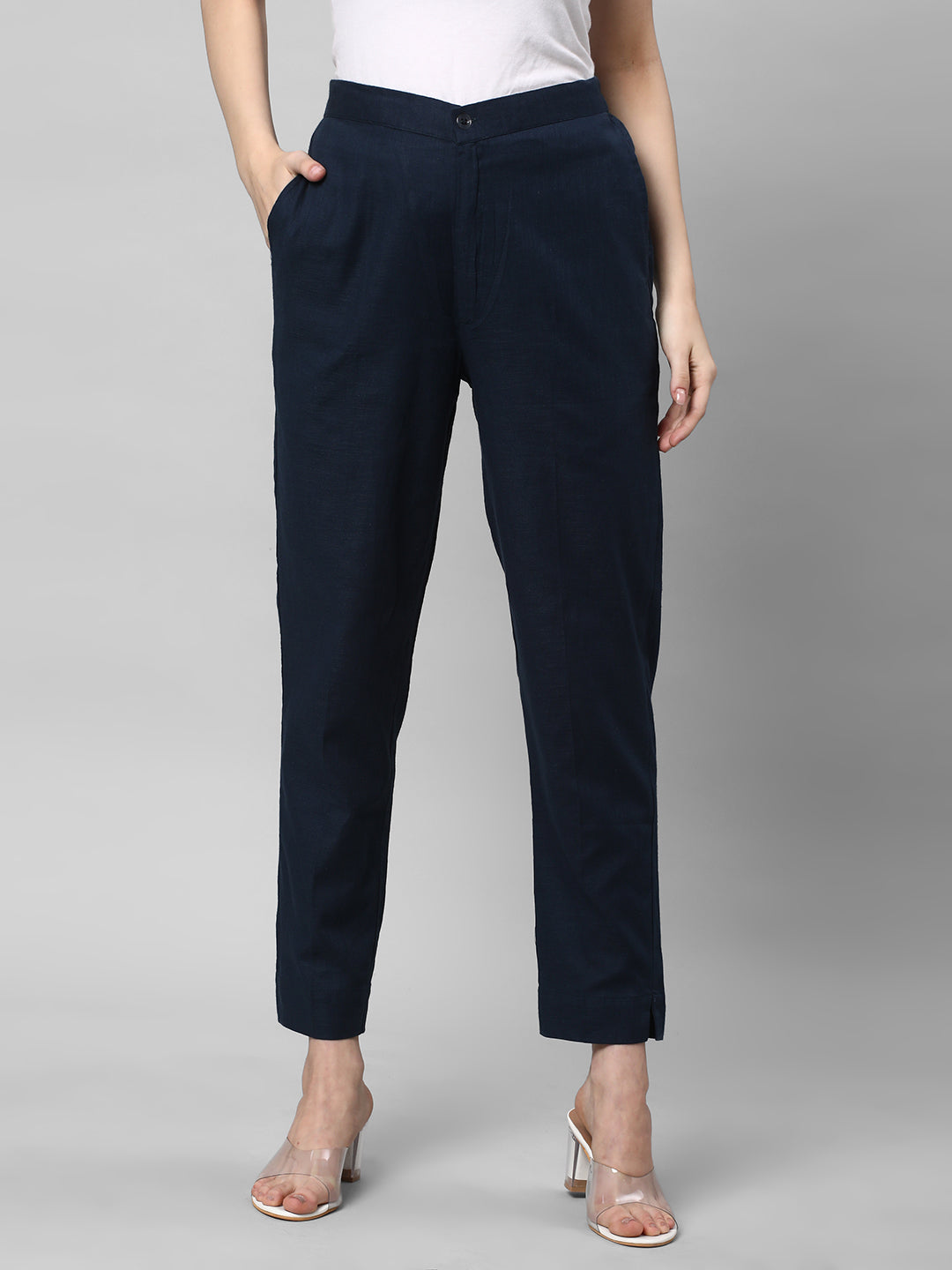 A blue ankle length cotton linen pant with plain belt in front
