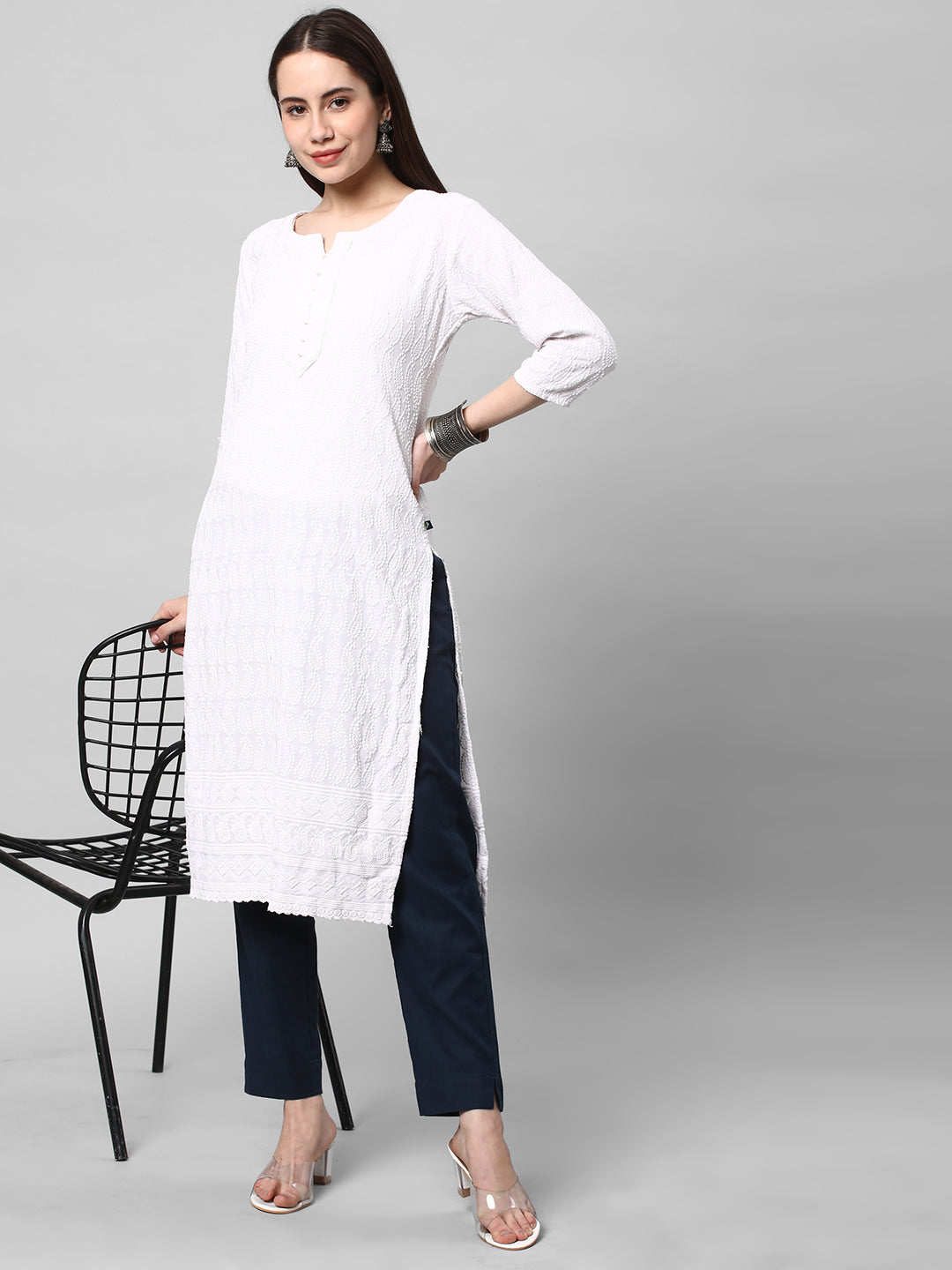 A blue ankle length cotton linen pant with plain belt in front