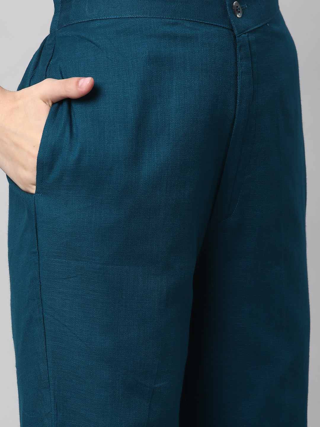 A Teal ankle length cotton linen pant with plain belt in front
