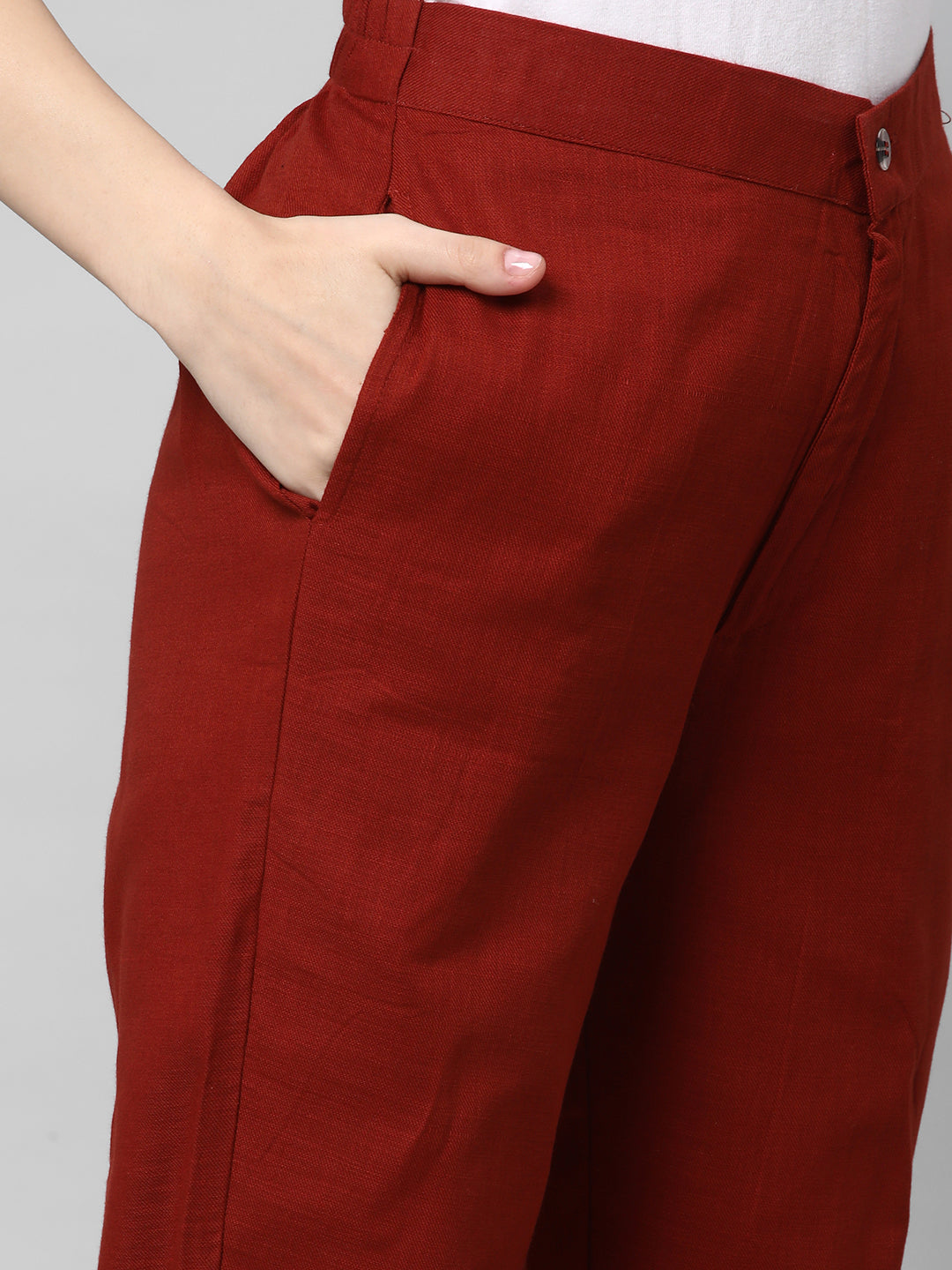 A Rust ankle length cotton linen pant with plain belt in front