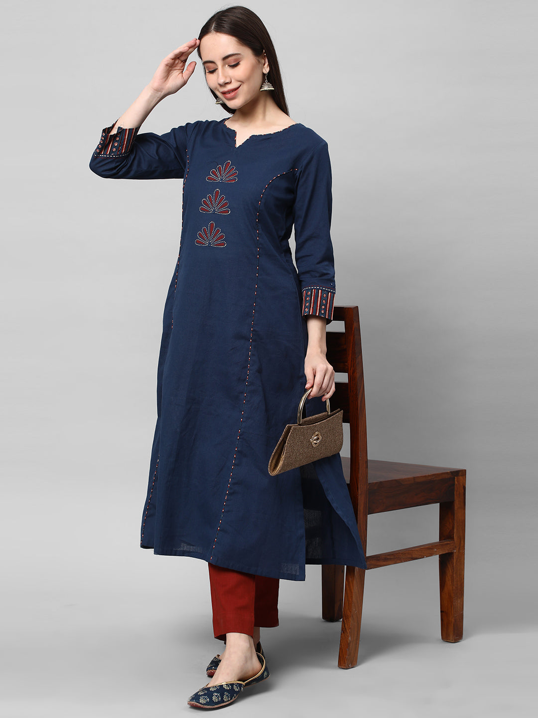 A Rust ankle length cotton linen pant with plain belt in front