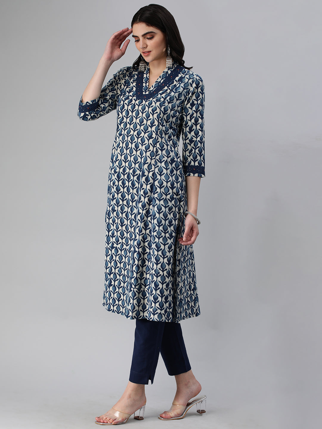 A flared bagru printed kurta with schifli detailing on V neck and cuff