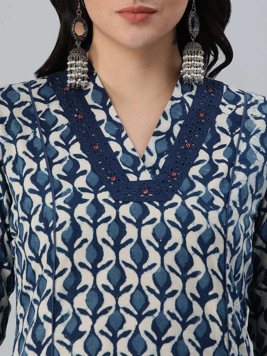 A flared bagru printed kurta with schifli detailing on V neck and cuff