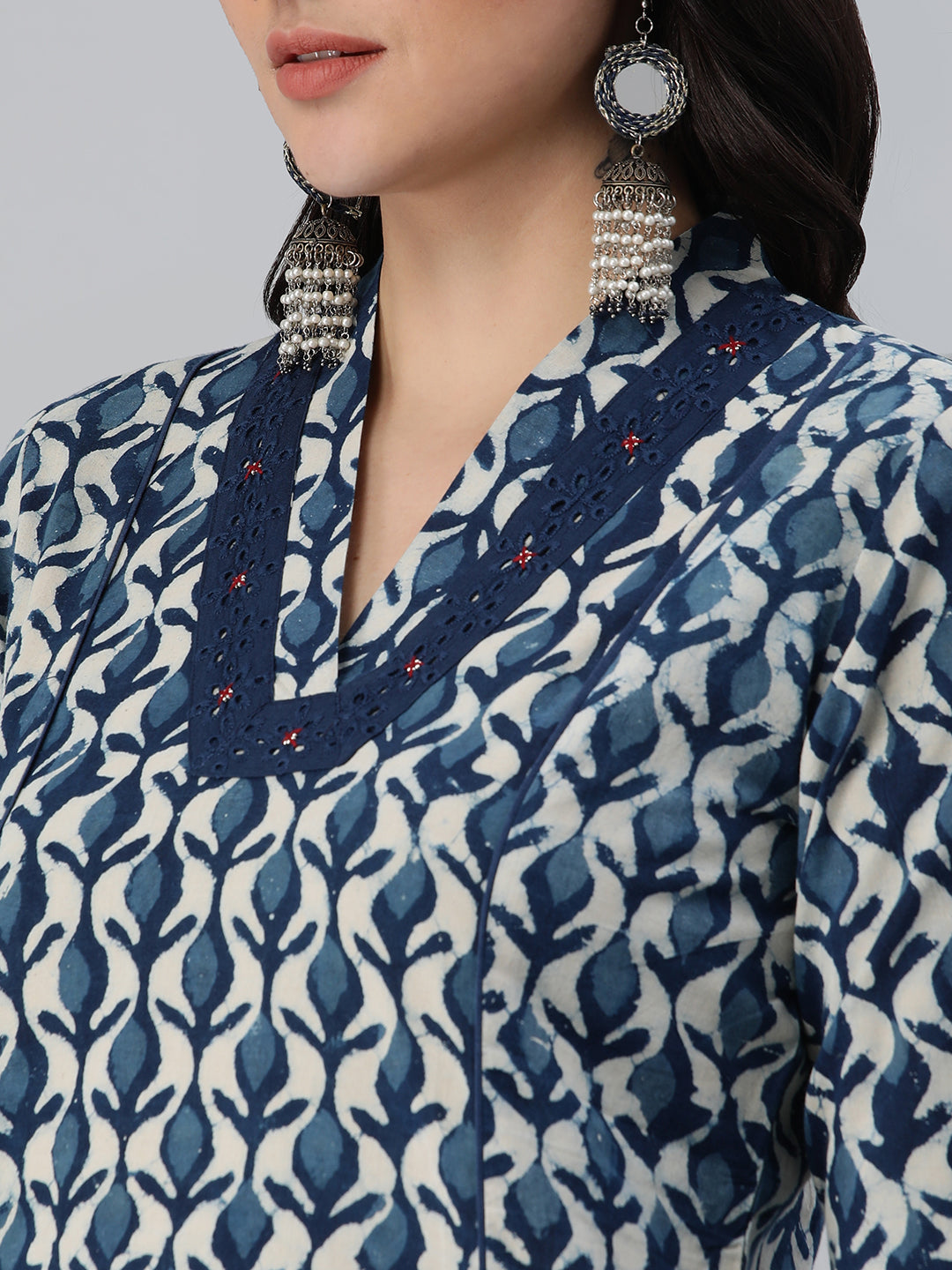 A flared bagru printed kurta with schifli detailing on V neck and cuff
