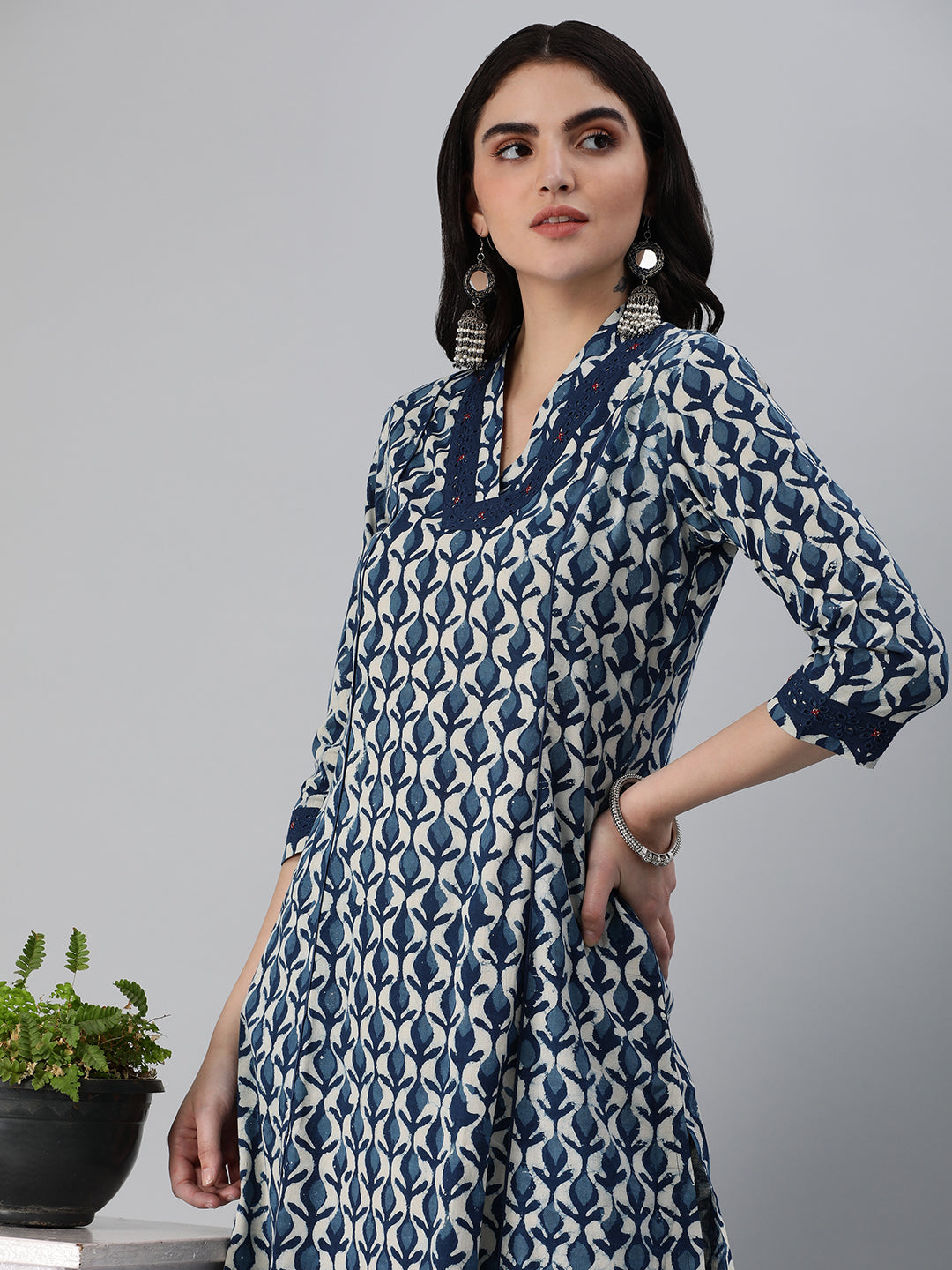 A flared bagru printed kurta with schifli detailing on V neck and cuff