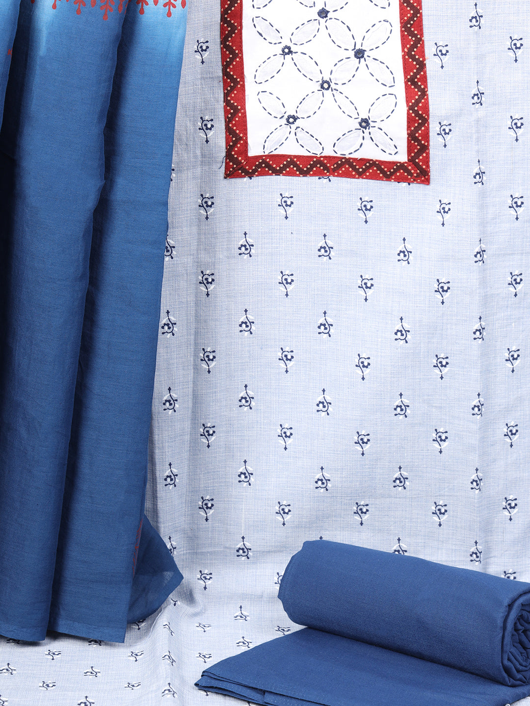 Unstitched printed suit set with a contrast colour applique yoke that emphasizes handwork and printed dupatta