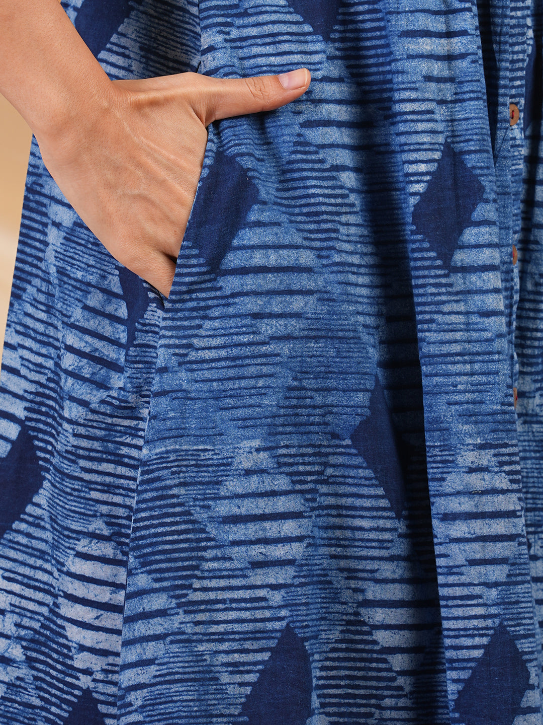 A-Line Pleated sleeveless dress in cotton dhabu print