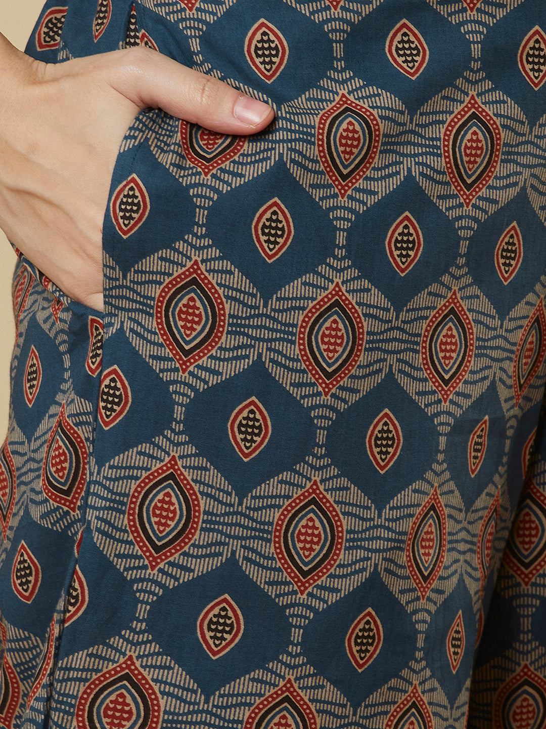 A mustard kurta suit set featuring a mix-match yoke and hand applique