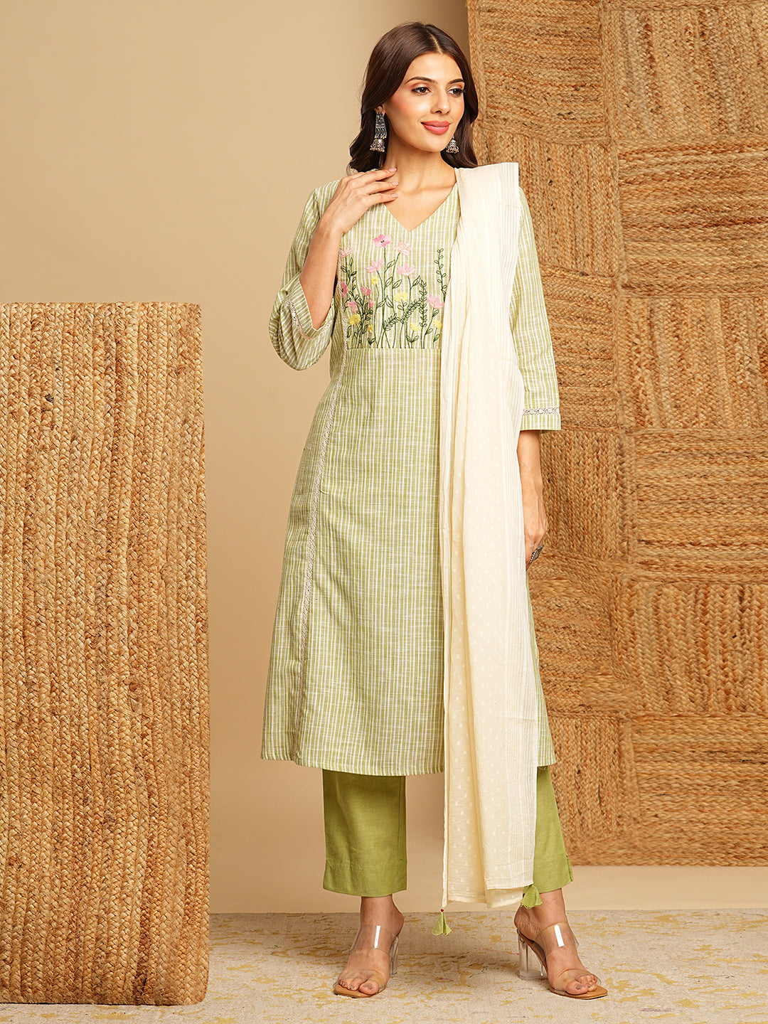Light green straight kurta with delicate lace detailing and embroidery on the yoke paired With a beige mull dupatta and self bottom