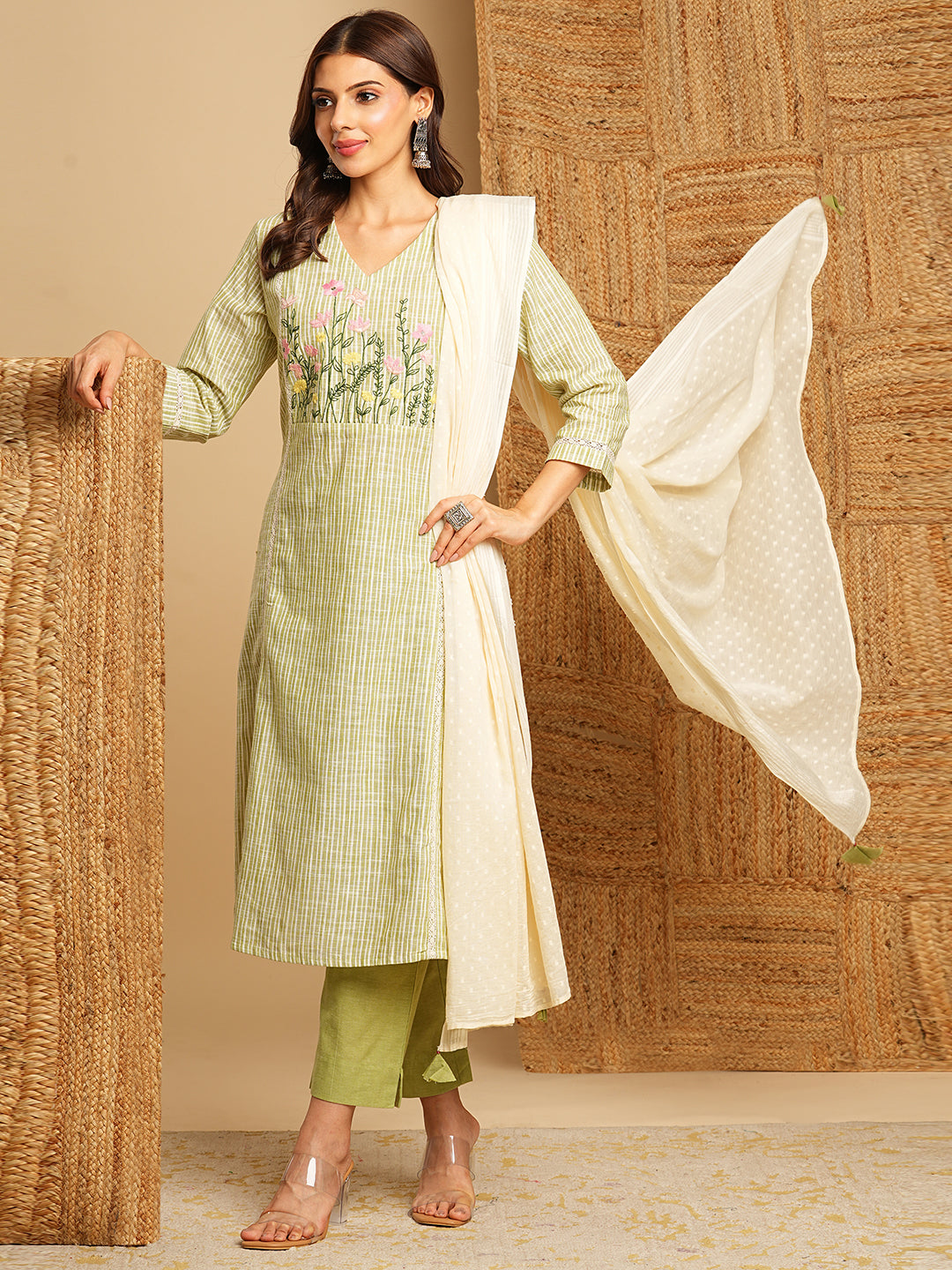 Light green straight kurta with delicate lace detailing and embroidery on the yoke paired With a beige mull dupatta and self bottom