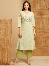 Light green straight kurta with delicate lace detailing  and embroidery on the yoke paired With a beige mull dupatta and self bottom