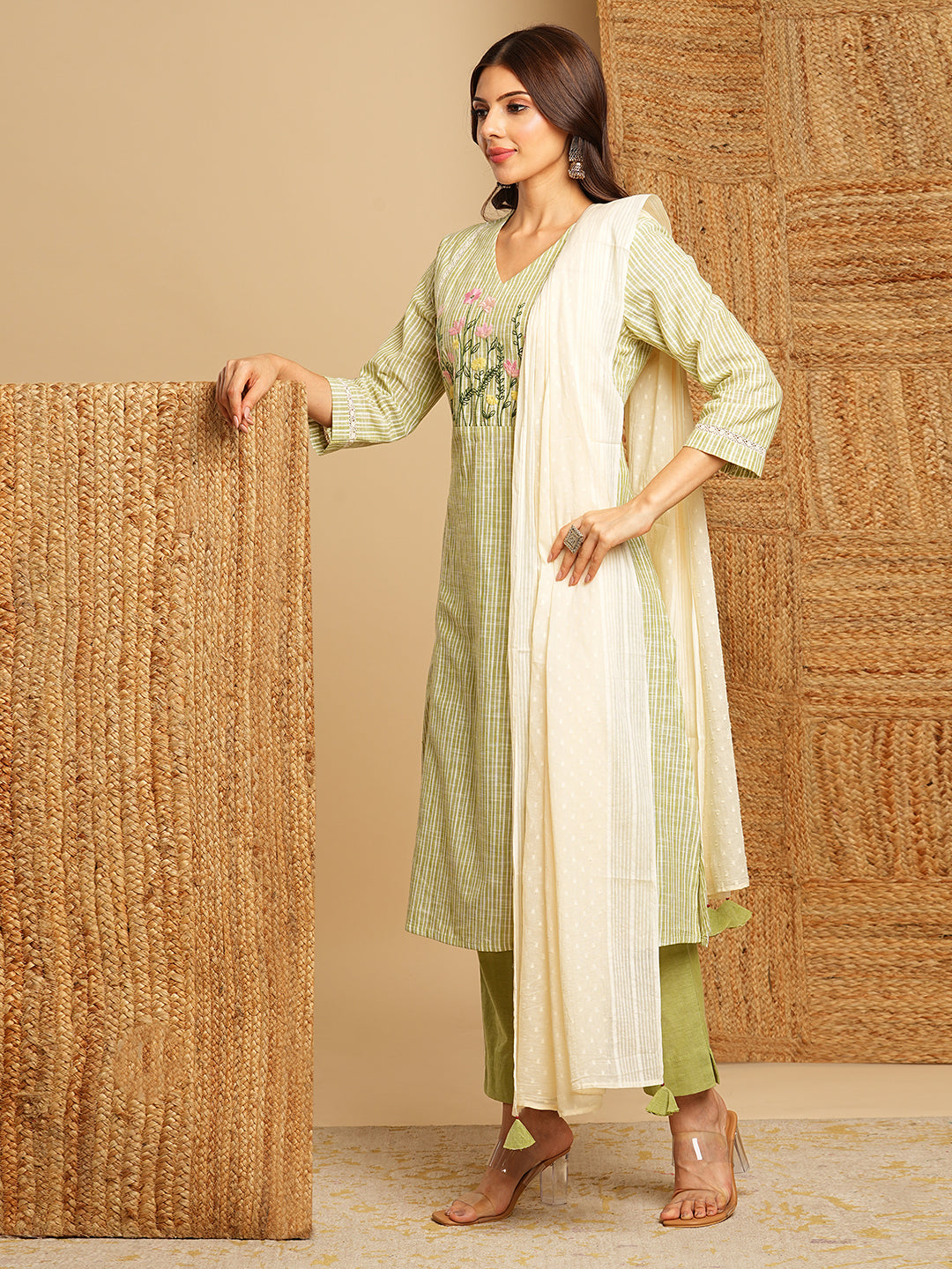 Light green straight kurta with delicate lace detailing and embroidery on the yoke paired With a beige mull dupatta and self bottom