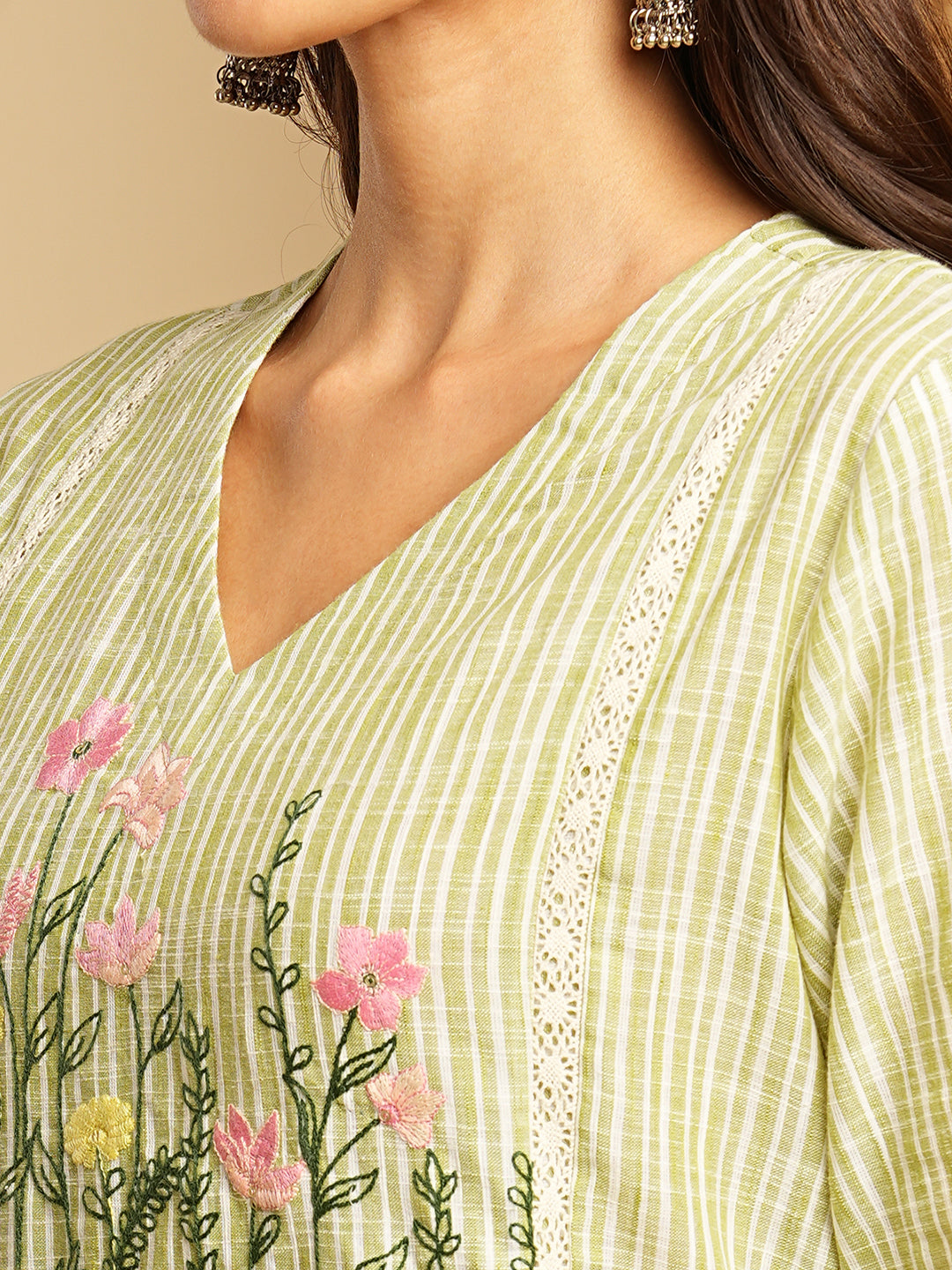 Light green straight kurta with delicate lace detailing and embroidery on the yoke paired With a beige mull dupatta and self bottom