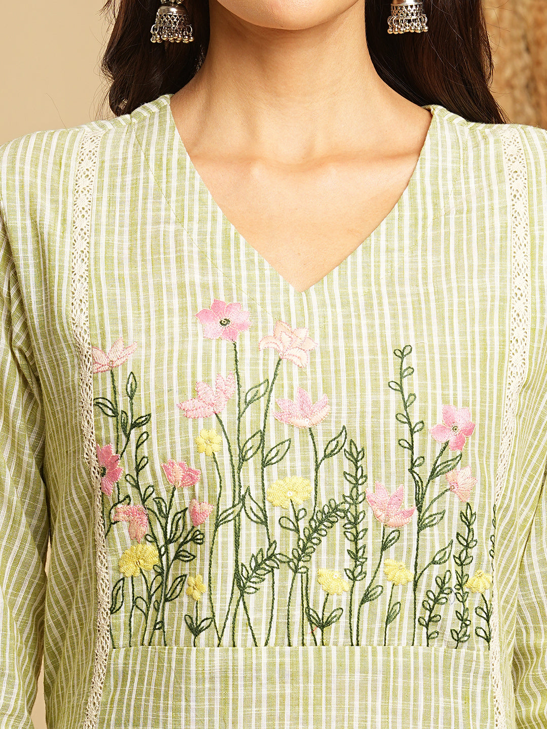 Light green straight kurta with delicate lace detailing and embroidery on the yoke paired With a beige mull dupatta and self bottom