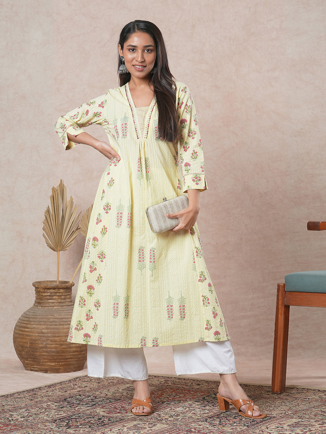 A-line cotton kurta with embroidered neckline and blend of two different prints