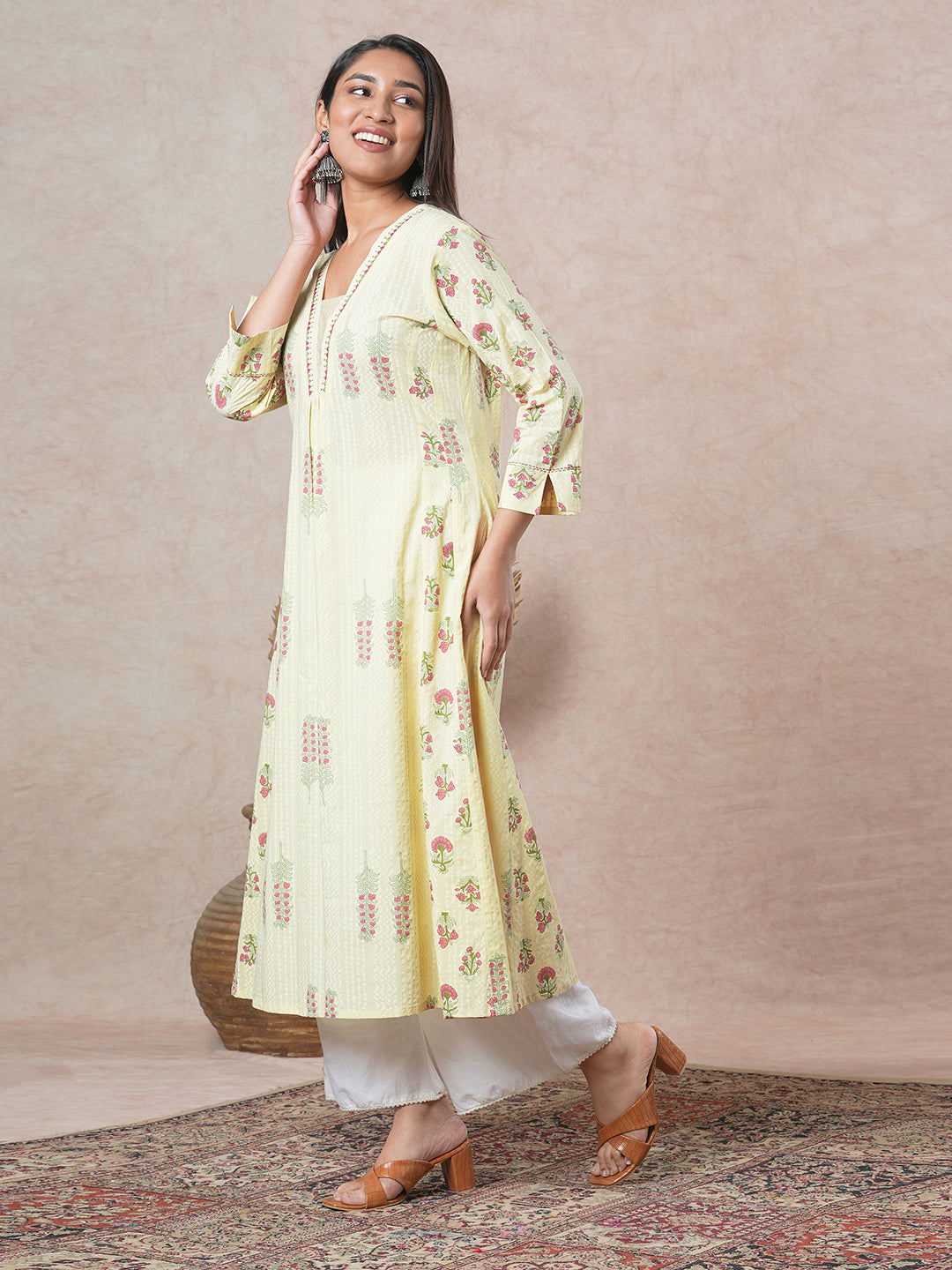 A-line cotton kurta with embroidered neckline and blend of two different prints