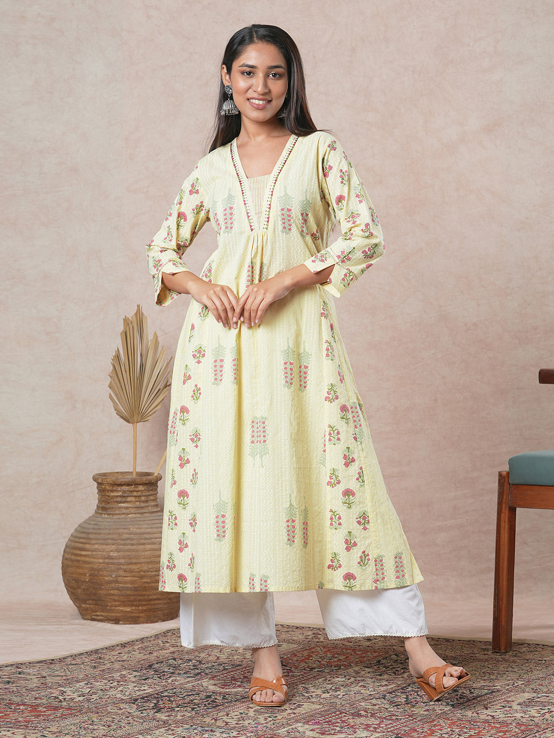 A-line cotton kurta with embroidered neckline and blend of two different prints