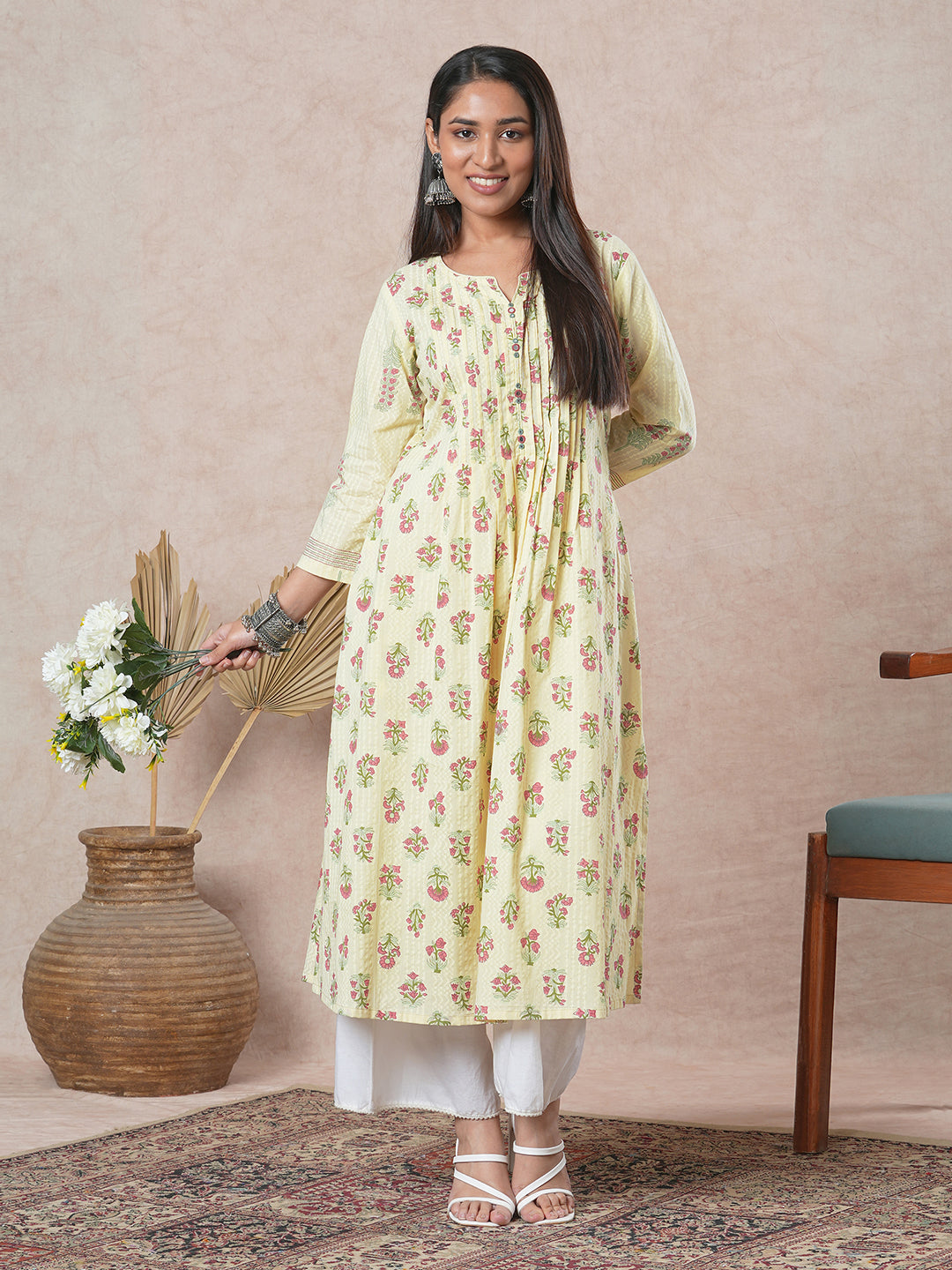 A flared cotton kurta with embroidered neckline and blend of two different prints