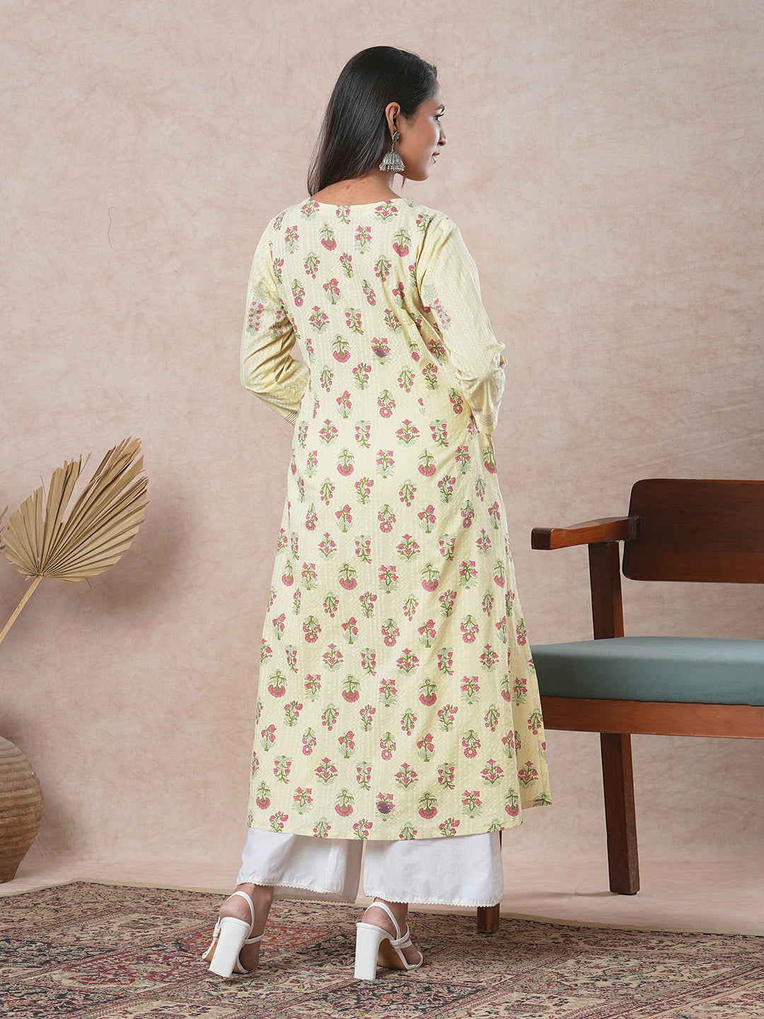 A flared cotton kurta with embroidered neckline and blend of two different prints
