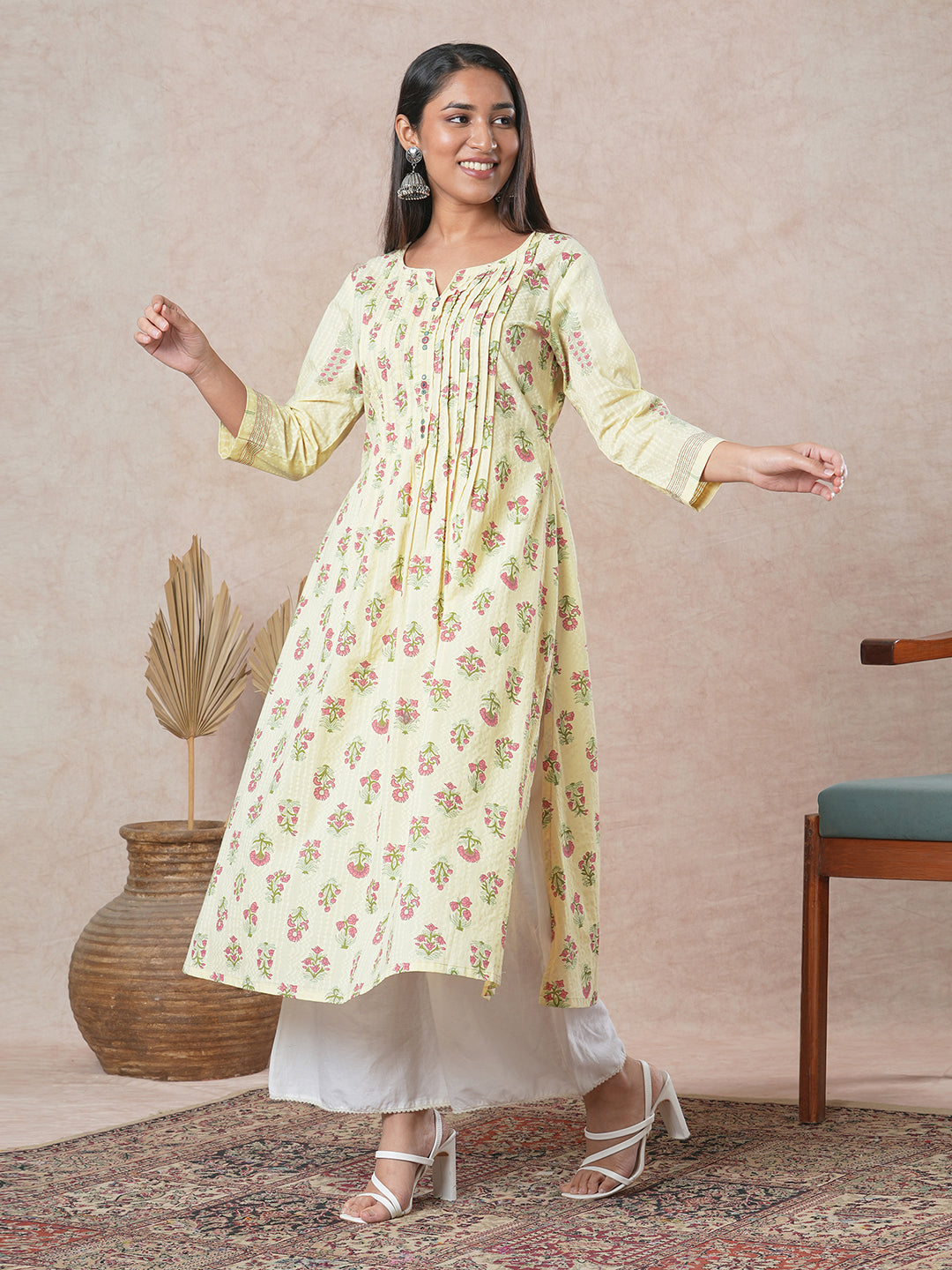 A flared cotton kurta with embroidered neckline and blend of two different prints