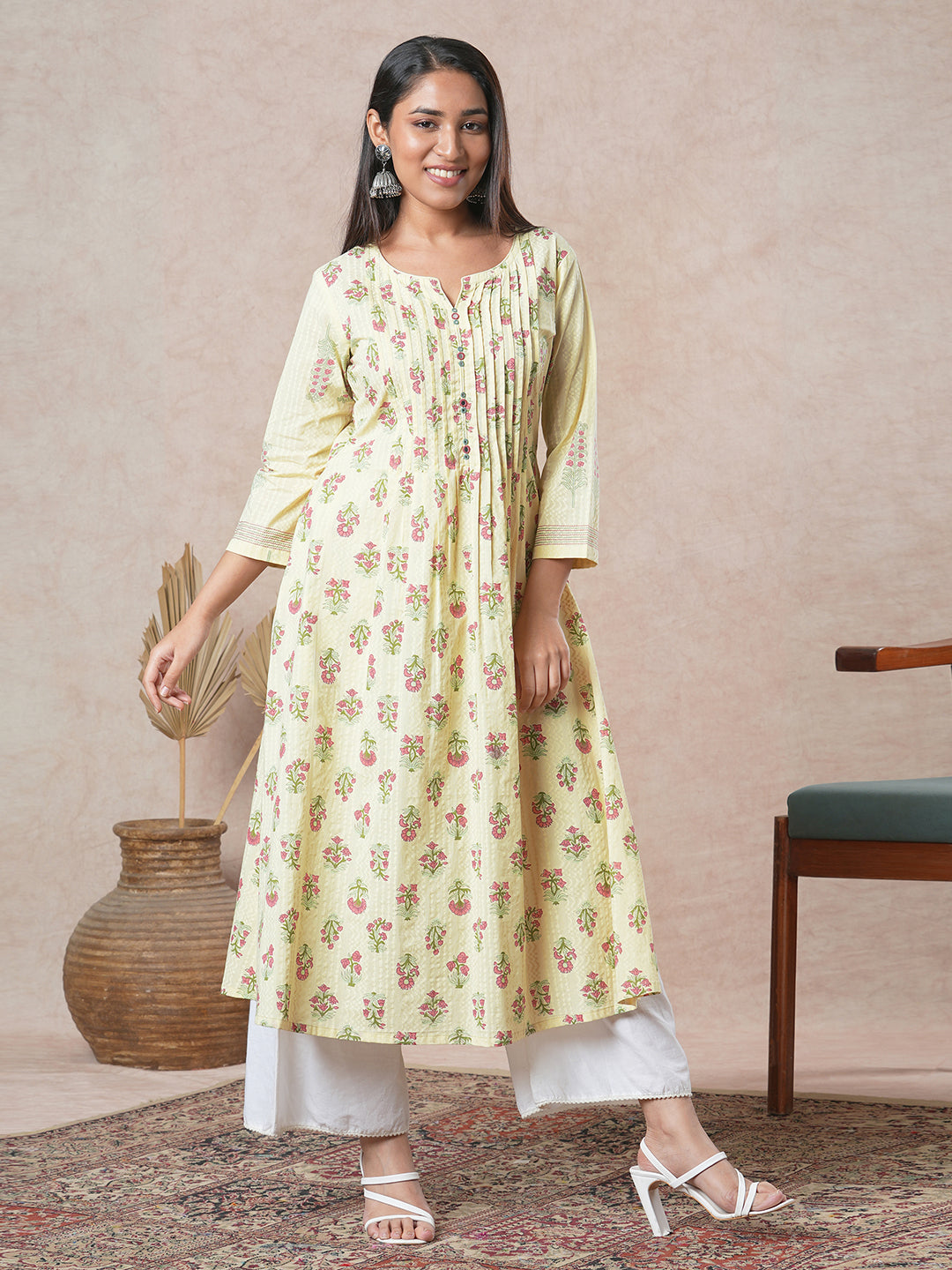 A flared cotton kurta with embroidered neckline and blend of two different prints