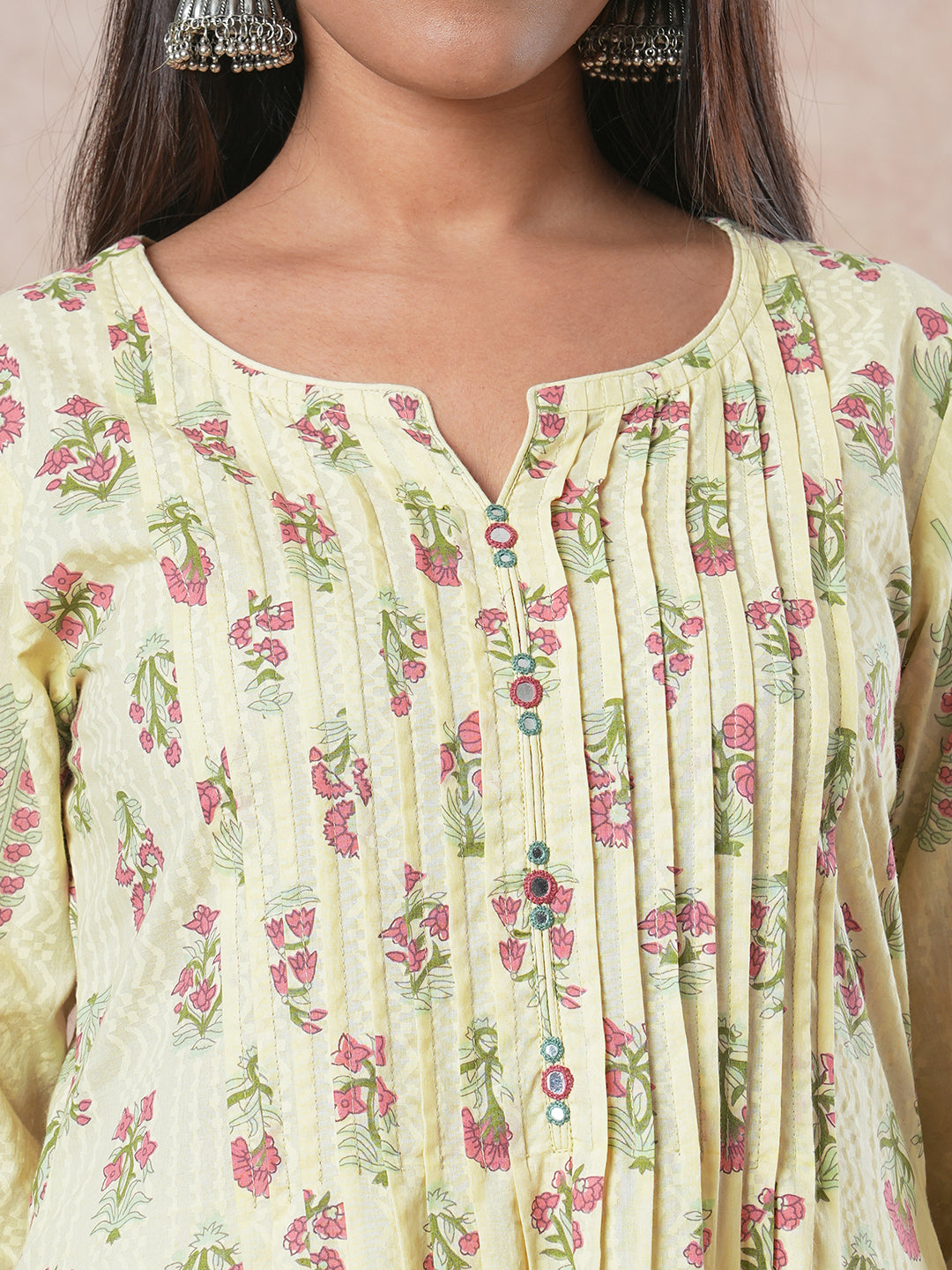 A flared cotton kurta with embroidered neckline and blend of two different prints
