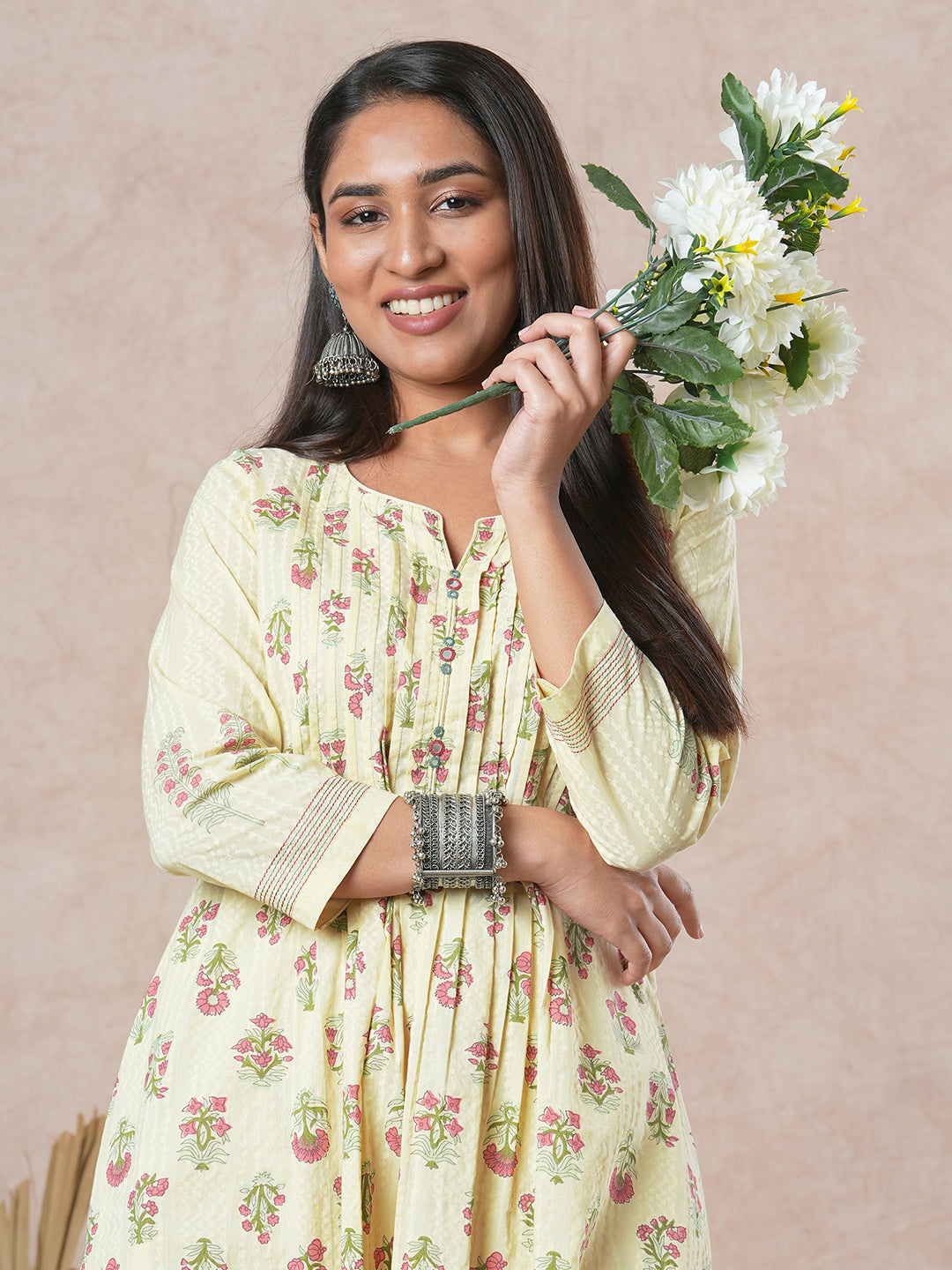 A flared cotton kurta with embroidered neckline and blend of two different prints