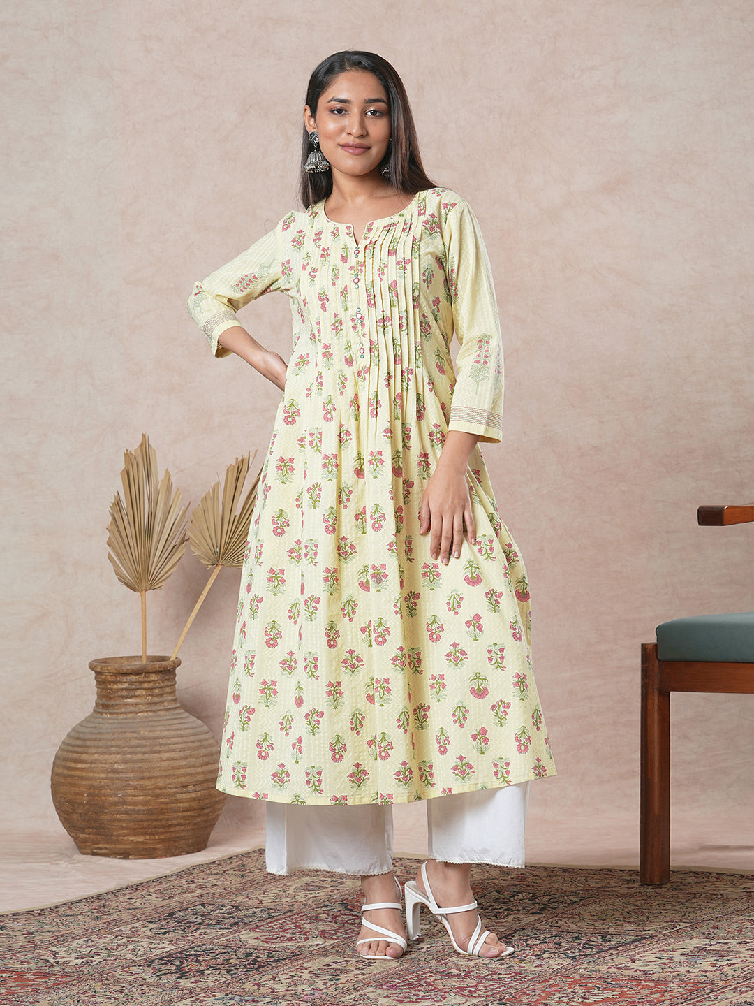 A flared cotton kurta with embroidered neckline and blend of two different prints