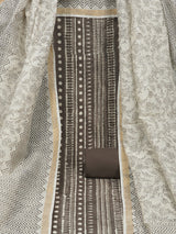 Brown unstitched suit set with traditional geometric dabu print along with printed dupatta and solid bottom